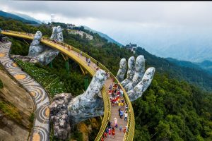 Golden Bridge held by giant stone hands at Ba Na Hills near Da Nang